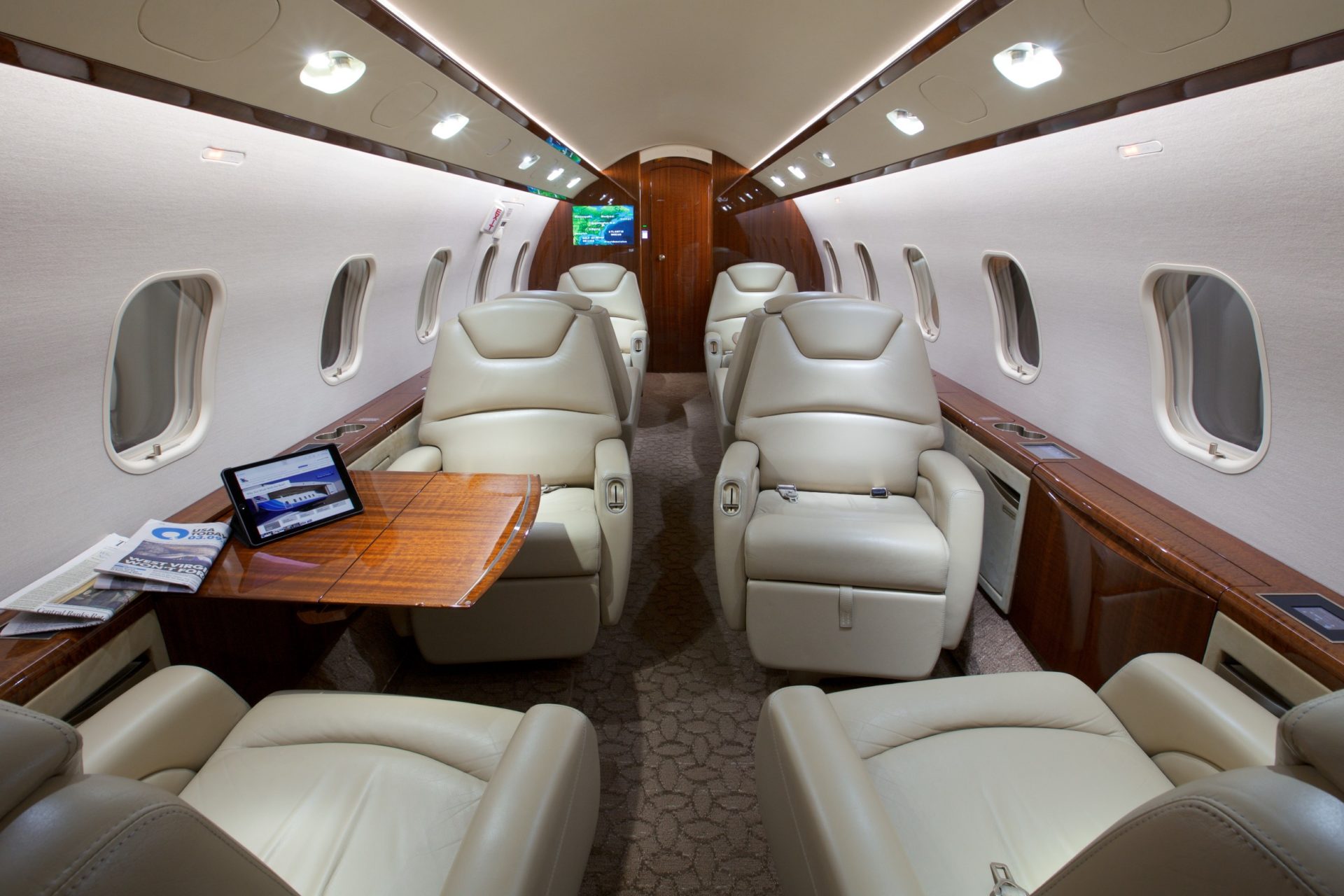Cabin area with 8 reclining seats and tables